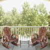 60*89*94cm Garden Outdoor Fir with Wooden Wheel Wooden Rocking Chair Carbonized Color